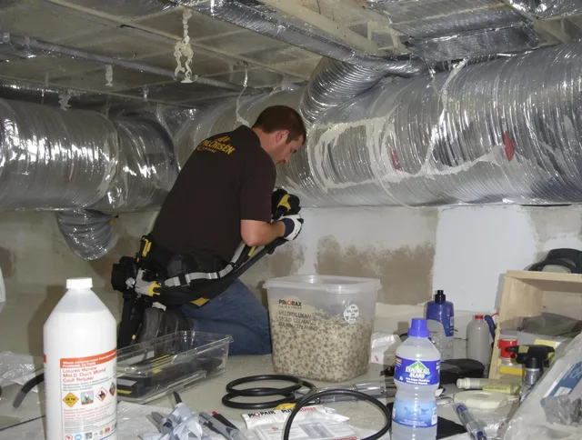Hanson Air Duct Cleaning specialist performing professional mold removal from air ducts in Hanson