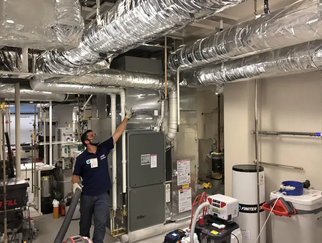 Hanson Air Duct Cleaning specialist performing thorough furnace duct cleaning in a Hanson residence