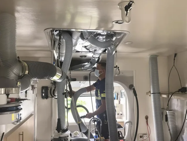 Hanson Air Duct Cleaning specialist performing precise mobile home duct cleaning in Hanson