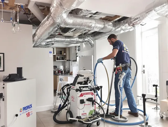 Hanson Air Duct Cleaning technician performing advanced pure duct cleaning with specialized equipment in Hanson