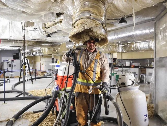 Professional vacuum insulation removal by Hanson Air Duct Cleaning expert in Hanson